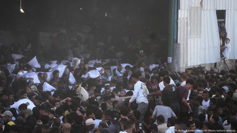 Crowd of starving Palestinians storms UN warehouse in Gaza